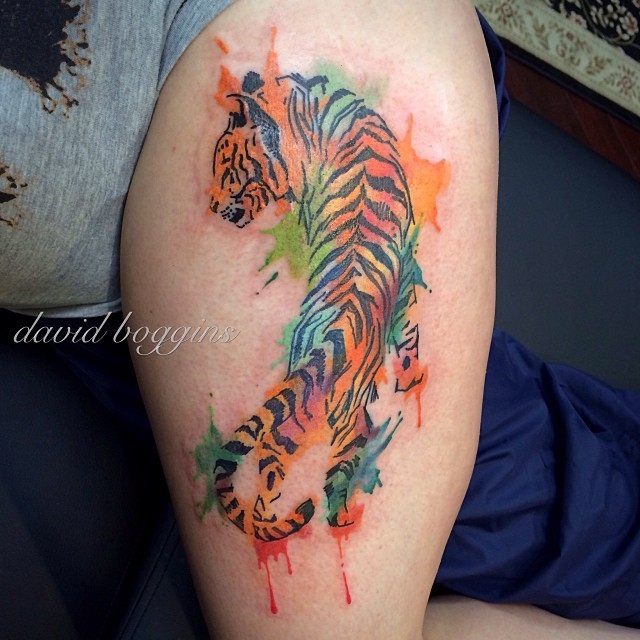 Watercolor tattoo of crawling tiger on leg - Tattooimages.biz